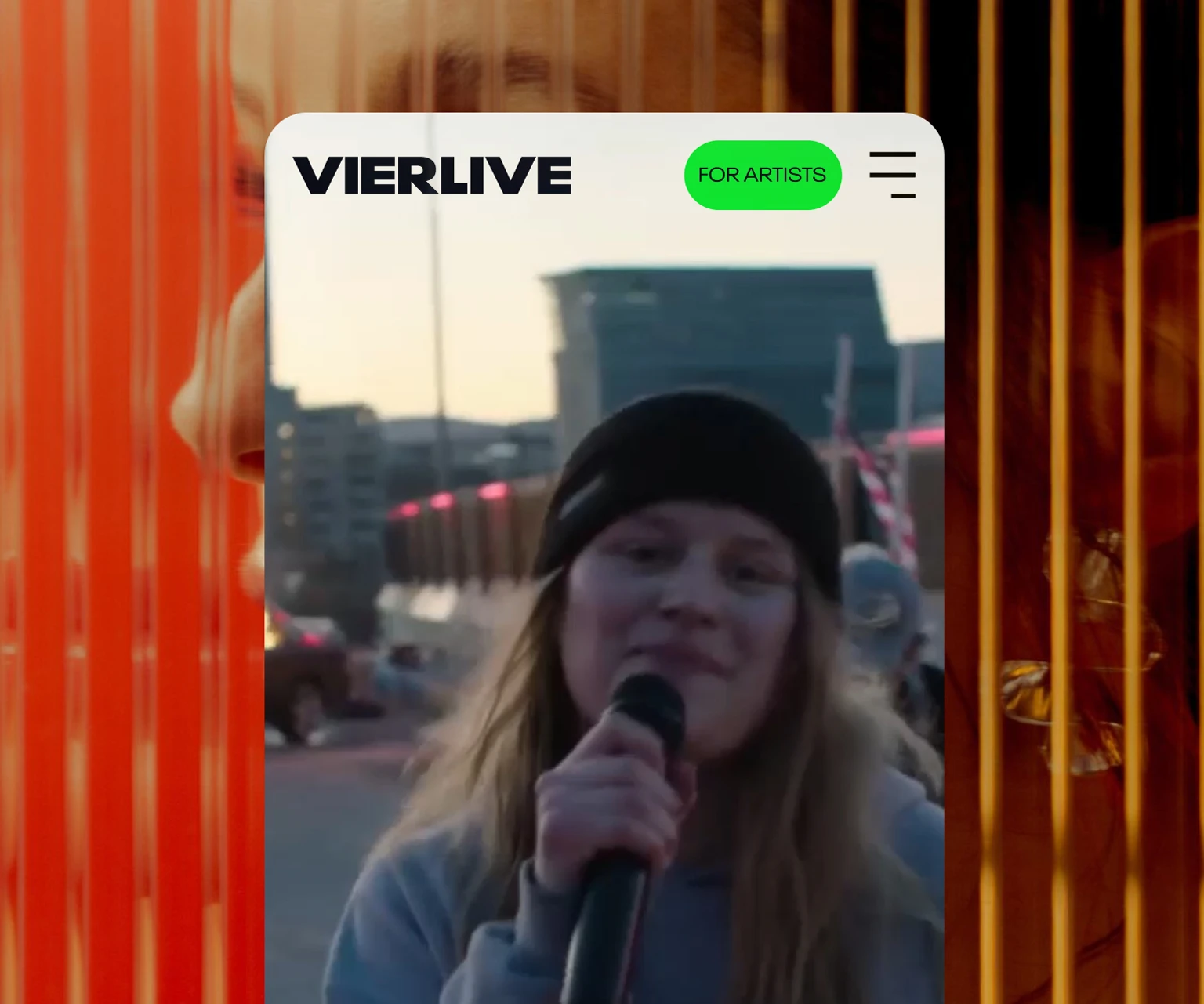 VIERLIVE app screenshot showing young artist performing live with microphone during outdoor event.